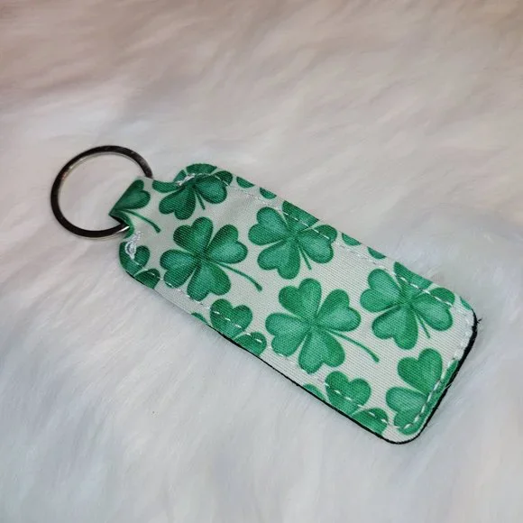 St. Patrick's Day White with Green Clovers Chapstick Lipstick Holder Keychain - Picture 2 of 2